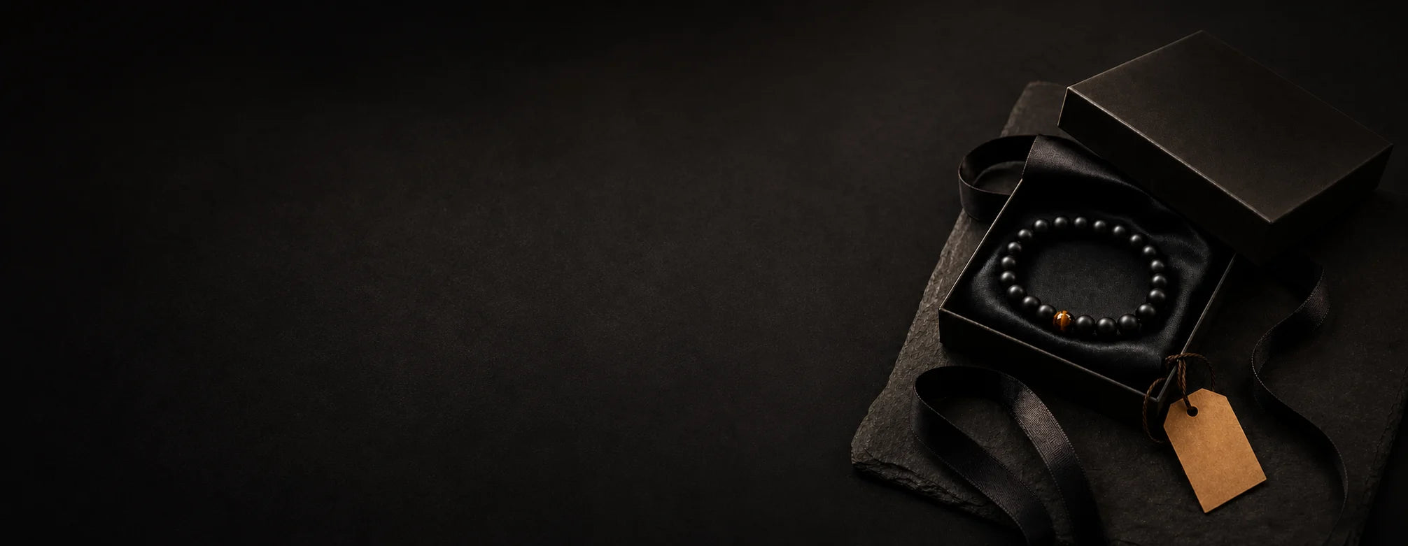 Gift-ready natural stone bracelet in a dark presentation box
